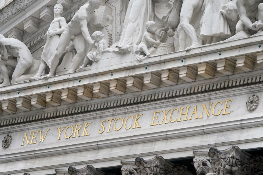 FILE - This Nov. 23, 2020 file photo shows the sign of the New York Stock Exchange in New York, Monday, Nov. 23, 2020. (AP Photo/Seth Wenig, File)