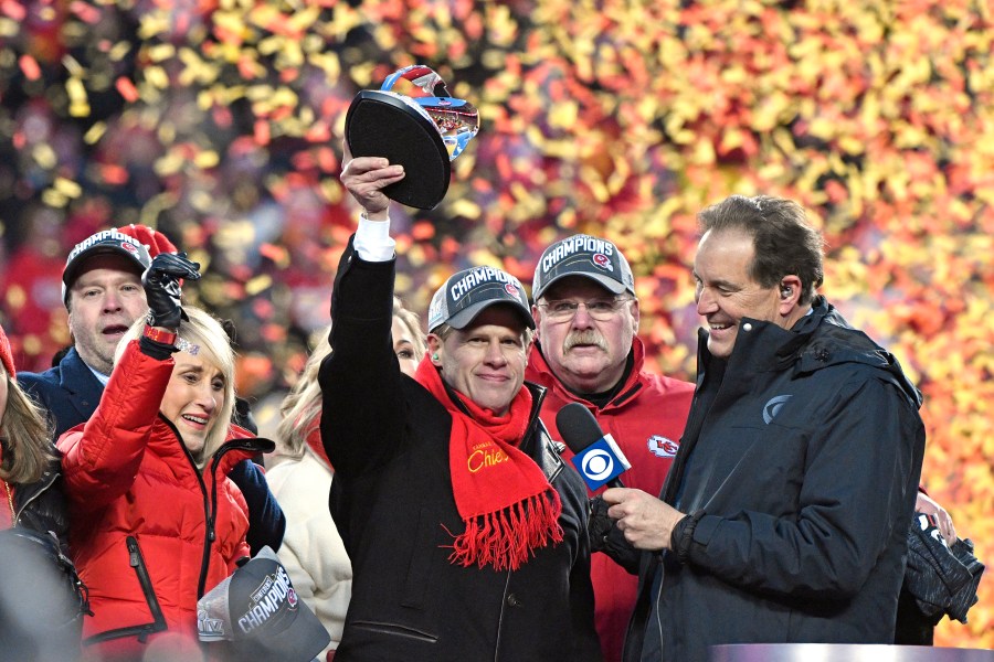 FILE - Norma Hunt, left, and her son Clark Hunt, center, owners of the Kansas City Chiefs, and Chiefs head coach Andy Reid, second right, celebrate after the AFC Championship NFL football game against the Tennessee Titans in Kansas City, Mo., Jan. 19, 2020. For the first time since her husband Lamar Hunt coined the term “Super Bowl,” and their team promptly lost to the Green Bay Packers, the matriarch of the Kansas City Chiefs will not be at the big game Sunday. Norma Hunt died this past summer at the age of 85, leaving a void that is still being felt among the Chiefs, and in particular, her son and team chairman Clark Hunt. (AP Photo/Jeff Roberson, File)