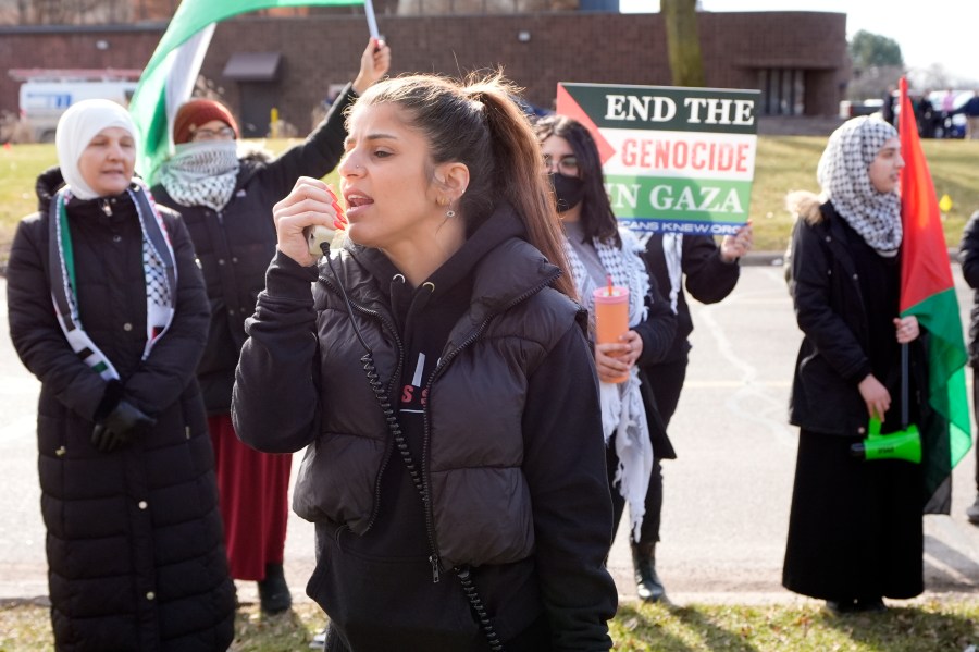 Lexis Zeidan yells chants to about three dozen people protesting Israel's attacks in Gaza, Thursday, Feb. 8, 2024 in Dearborn, Mich. The protesters gathered hoping to be heard by members of the Biden White House who were scheduled to meet in suburban Detroit with Muslim and Arab American leaders. (AP Photo/Carlos Osorio)