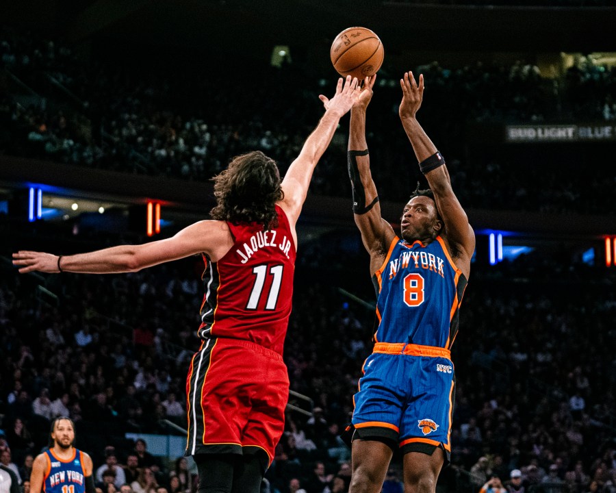 New York Knicks forward OG Anunoby (8) shoots over Miami Heat guard Jaime Jaquez Jr. (11) during the second half of an NBA basketball game, Saturday, Jan. 27, 2024, in New York. (AP Photo/Peter K. Afriyie)