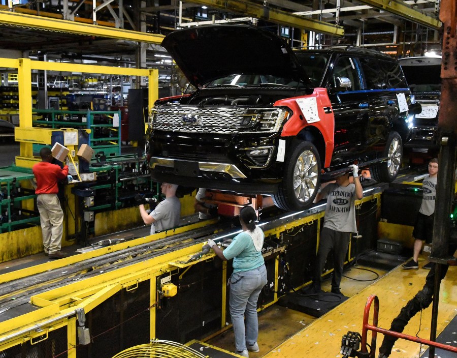 FILE - Workers assemble Ford trucks at the Ford Kentucky Truck Plant, Friday, Oct. 27, 2017, in Louisville, Ky. The United Auto Workers union said Friday, Feb. 16, 2024, members will go on strike Feb. 23 at the Kentucky Truck Plant, Ford’s most profitable factory, if a local contract dispute is not resolved. (AP Photo/Timothy D. Easley, File)