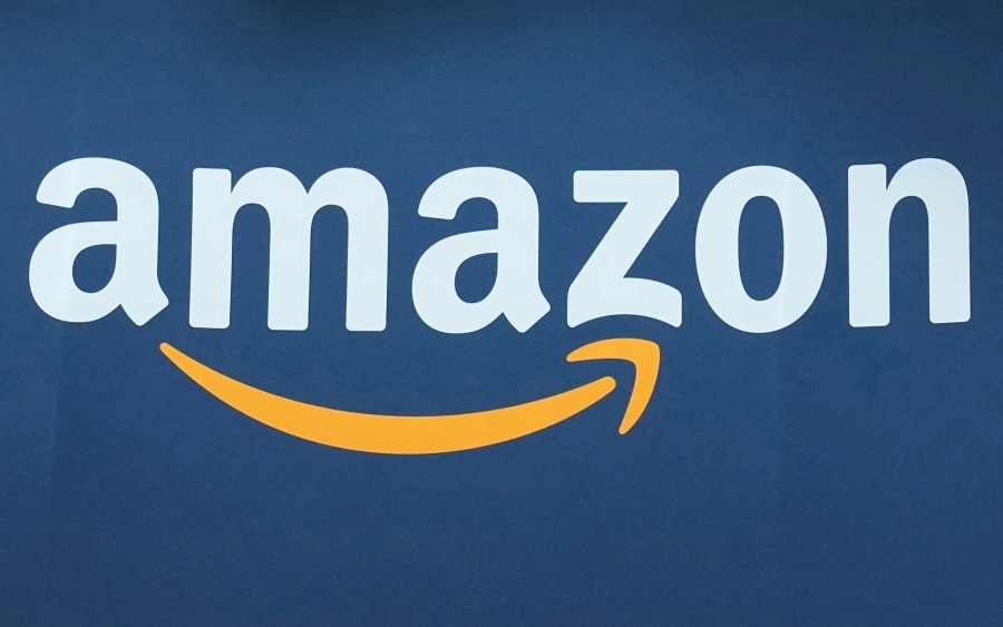 FILE - The Amazon logo is seen, June 15, 2023, at the Vivatech show in Paris. Amazon releases results on Thursday, Feb. 1, 2024. (AP Photo/Michel Euler, File)