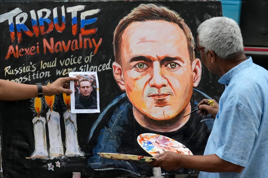 Prithviraj Kambli, an art school teacher, pays tribute to the Russian opposition leader Alexei Navalny, who died on Friday, by painting a portrait of him in Mumbai, India, Saturday, Feb. 17, 2024. (AP Photo/Rajanish Kakade)