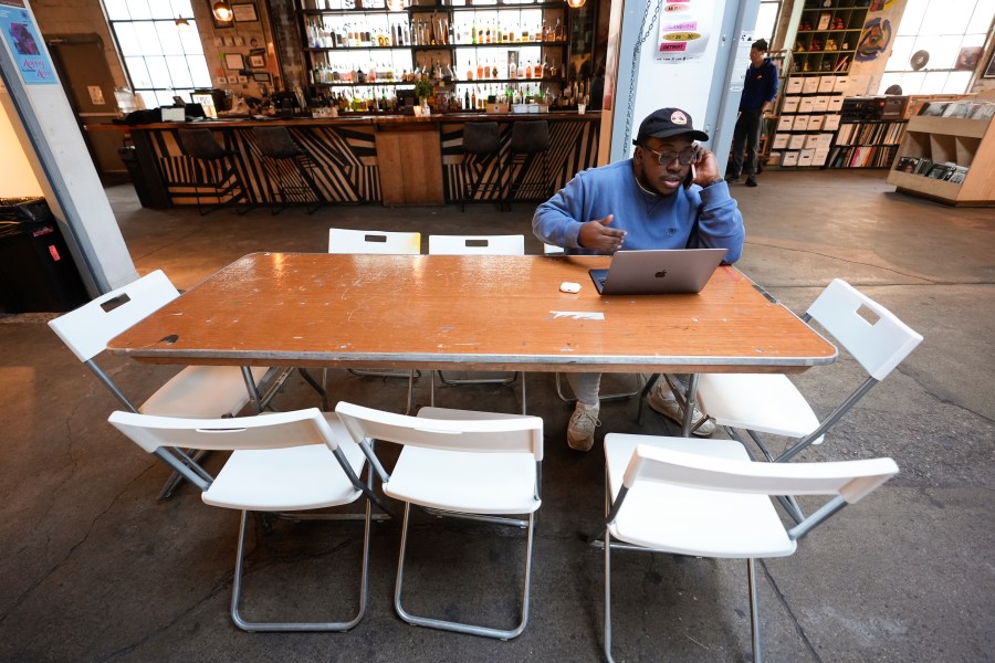 **HOLD FOR COREY WILLIAMS STORY** Kamau Jawara, of Detroit, calls a voter for the Listen to Michigan uncommitted vote campaign in Detroit, Tuesday, Feb. 20, 2024. (AP Photo/Paul Sancya)