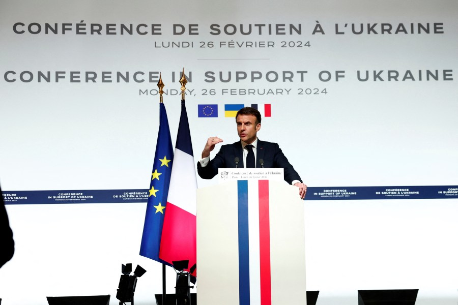 French President Emmanuel Macron speaks during a press conference at the Elysee Palace in Paris, Monday, Feb. 26, 2024. More than 20 European heads of state and government and other Western officials are gathering in a show of unity for Ukraine, signaling to Russia that their support for Kyiv isn't wavering as the full-scale invasion grinds into a third year. (Gonzalo Fuentes/Pool via AP)