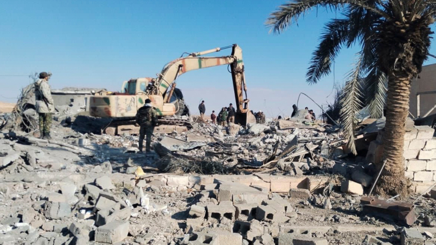 Members of Iraqi Shiite Popular Mobilization Forces clean the rubble after a U.S. airstrike in al-Qaim, Iraq, Saturday, Feb. 3, 2024. The U.S. Central Command said in a statement on Friday that the U.S. forces conducted airstrikes on more than 85 targets in Iraq and Syria against Iran's Islamic Revolutionary Guards Corps and affiliated militia groups.
