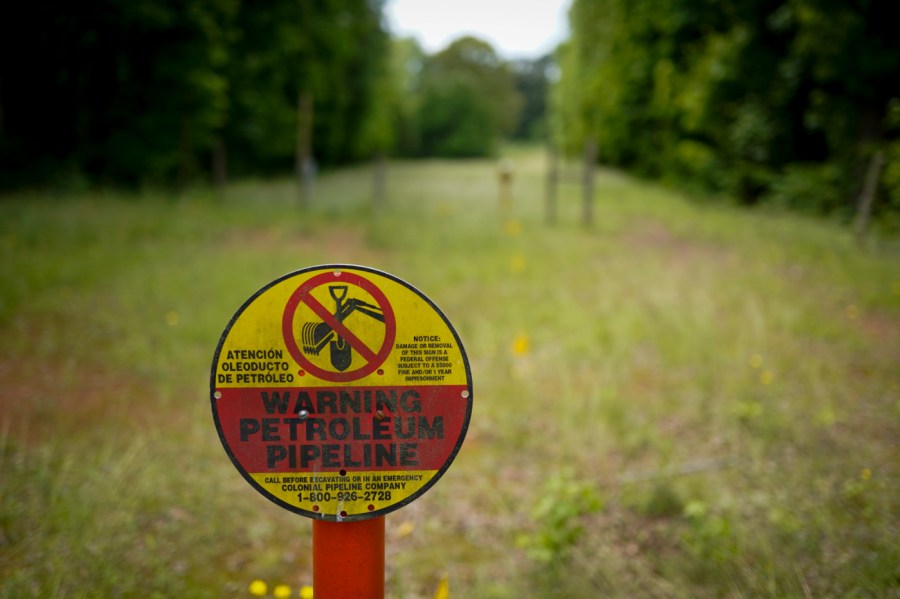 In this May 11, 2021 file photo, a sign marking the location of the Colonial Pipeline is posted in Charlotte, N.C.