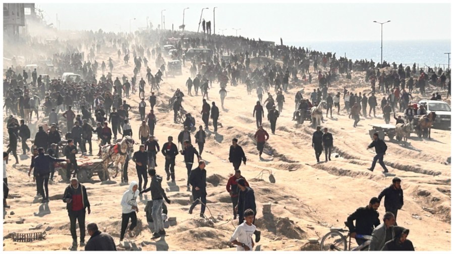 Palestinians wait for humanitarian aid on a beachfront in Gaza City, Gaza Strip, Sunday, Feb. 25, 2024. (AP Photo/Mahmoud Essa)