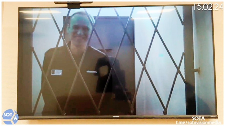 This photo taken from video released by Russian Federal Penitentiary Service via SOTAVISION shows Russian opposition leader Alexei Navalny appears via a video link from the Arctic penal colony in Kharp, in the Yamalo-Nenetsk region about 1,900 kilometers (1,200 miles) northeast of Moscow, where he is serving a 19-year sentence, in Kovrov, Russia, on Feb. 15, 2024. (Russian Federal Penitentiary Service via SOTAVISION via AP)