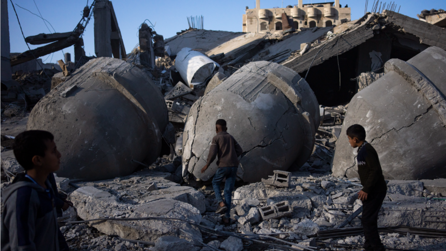 Palestinians look at the destruction after an Israeli strike on residential buildings and a mosque in Rafah, Gaza Strip, Thursday, Feb. 22, 2024.