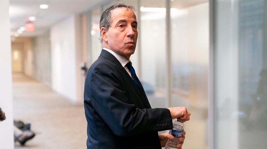 Rep. Jamie Raskin turns to look back after returning from a lunch break in a deposition of Hunter Biden.