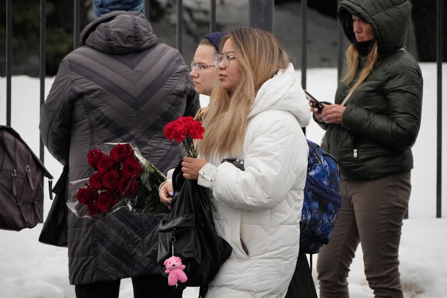 Women carry flowers outside the Church of the Icon of the Mother of God Soothe My Sorrows, in Moscow, Russia, Friday, March 1, 2024. Relatives and supporters of Alexei Navalny are bidding farewell to the opposition leader at a funeral in southeastern Moscow, following a battle with authorities over the release of his body after his still-unexplained death in an Arctic penal colony. (AP Photo)