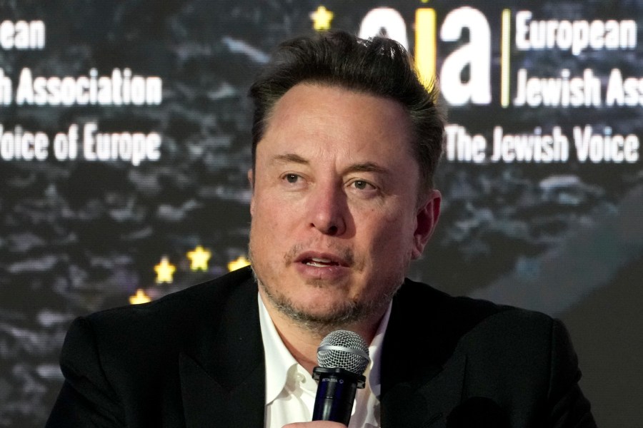 FILE - Tesla and SpaceX CEO Elon Musk addresses the European Jewish Association's conference, Jan. 22, 2024, in Krakow, Poland. Former senior executives of Twitter filed suit against Musk and X Corp. on Monday, March 4, saying they are entitled to more than $128 million total in unpaid severance payments. (AP Photo/Czarek Sokolowski, File)