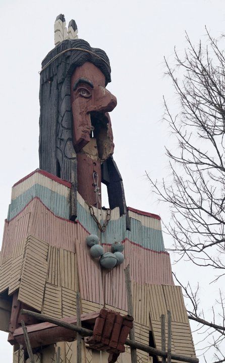 Police tape surrounds the Skowhegan Indian statue in Skowhegan, Maine on Tuesday March 5, 2024. The 62-foot-tall sculpture is currently missing an arm and part of its face, and it's believed to be due to the effects of the weather and a windstorm that left part of its face, an arm and a spear missing. (Rich Abrahamson /The Central Maine Morning Sentinel via AP)