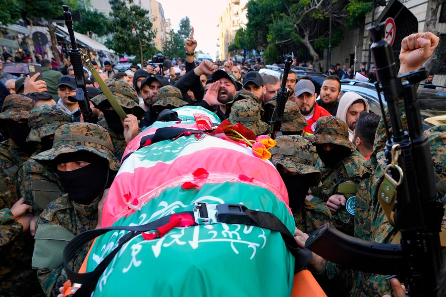 Islamic Group known as Jamaa Islamiya carry the body of their comrade Mohammad Riad Mohyeldin, who was killed in an apparent Israeli strike on Sunday, during his funeral procession in Beirut, Lebanon, Tuesday, March 12, 2024. (AP Photo/Bilal Hussein)