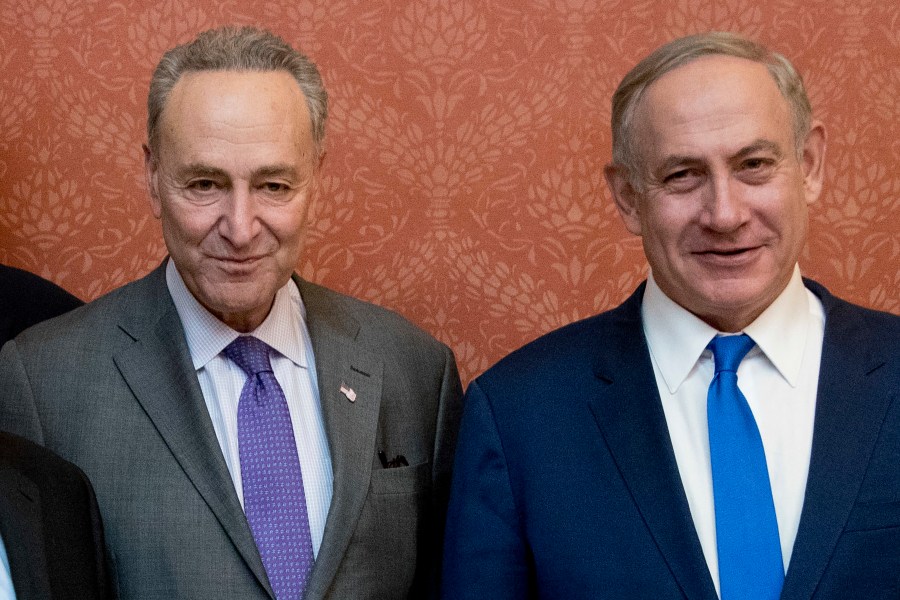 FILE - Israeli Prime Minister Benjamin Netanyahu, right, poses for a picture with Senate Minority Leader Chuck Schumer of New York, on Capitol Hill in Washington, Feb. 15, 2017. Schumer is calling on Israel to hold new elections. Schumer says he believes Israeli Prime Minister Benjamin Netanyahu has “lost his way” amid the Israeli bombardment of Gaza and a growing humanitarian crisis there. Schumer is the first Jewish majority leader in the Senate and the highest-ranking Jewish official in the U.S.. (AP Photo/Manuel Balce Ceneta, File)