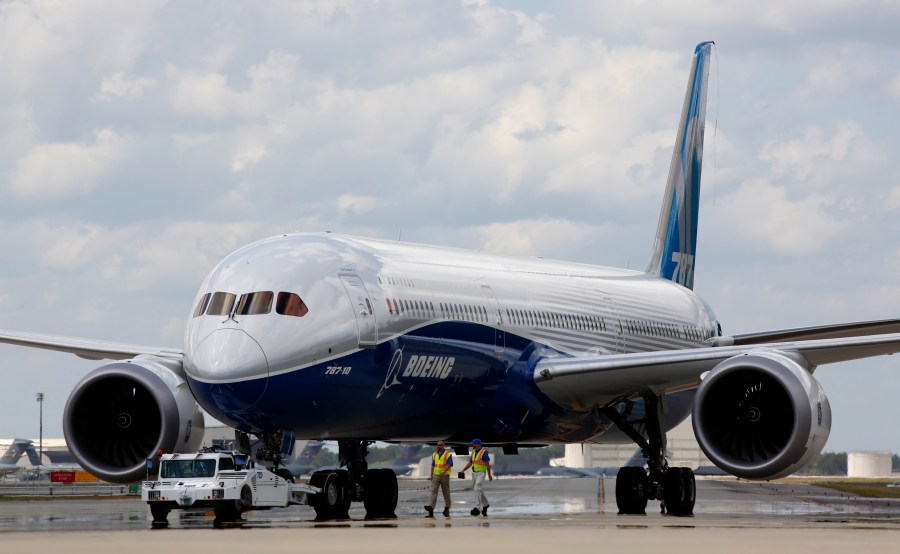 FILE - In this Friday, March 31, 2017, file photo, Boeing employees walk the new Boeing 787-10 Dreamliner down towards the delivery ramp area at the company's facility in South Carolina after conducting its first test flight at Charleston International Airport in North Charleston, S.C. Boeing, on Friday, March 15, 2024 is telling airlines to inspect switches on pilots' seats in its 787 Dreamliner jets after a published report said an accidental cockpit seat movement likely caused the sudden plunge of a LATAM Airlines plane flying to New Zealand.(AP Photo/Mic Smith, File)