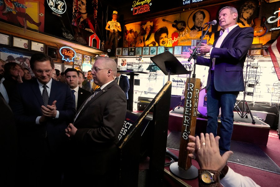 Gov. Bill Lee is applauded as he speaks before signing a bill Thursday, March 21, 2024, in Nashville, Tenn. The legislation is designed to protect songwriters, performers and other music industry professionals against the potential dangers of artificial intelligence. The signing took place in Robert's Western World, an historic honky tonk in downtown Nashville. (AP Photo/Mark Humphrey)