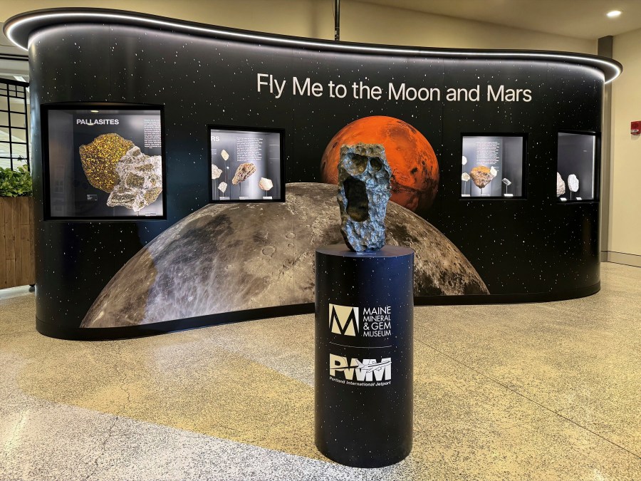 This March 20, 2024, photo by Darryl Pitt shows an installation at Portland International Jetport in Maine that features a large piece of the moon. The installation, which went live Tuesday, March 26, 2024, features the second largest piece of the moon on Earth. (Darryl Pitt via AP)