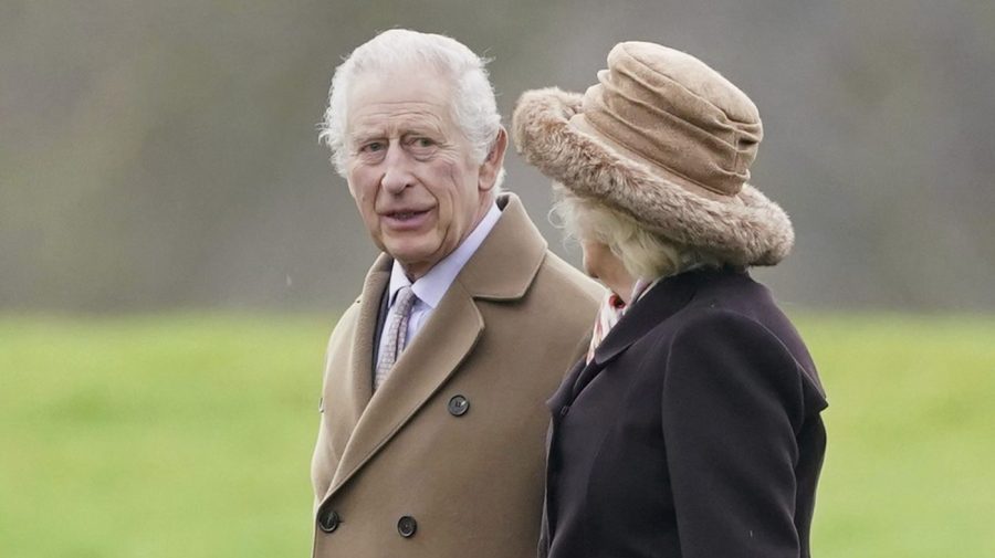 King Charles III and Queen Camilla talk while walking together.