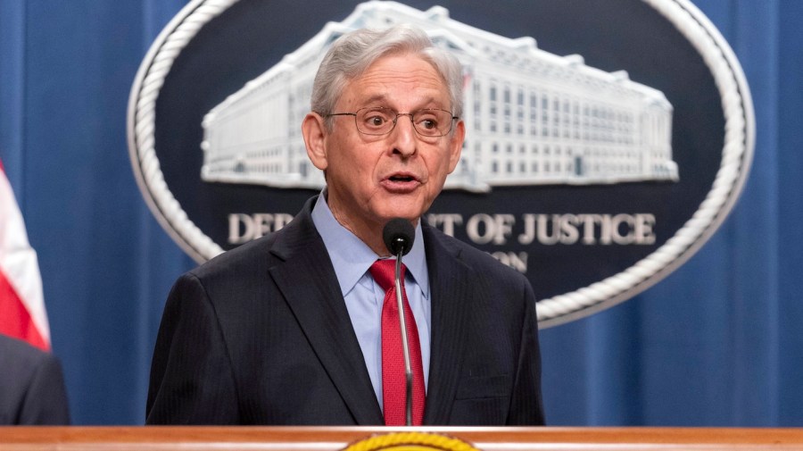 Merrick Garland speaks during a news conference.