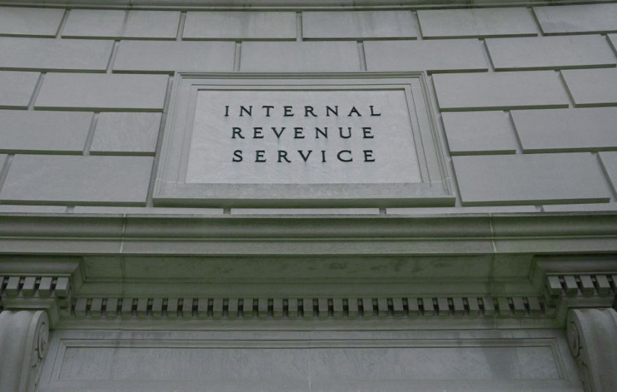 A sign for the Internal Revenue Service is seen engraved on the wall of a building.