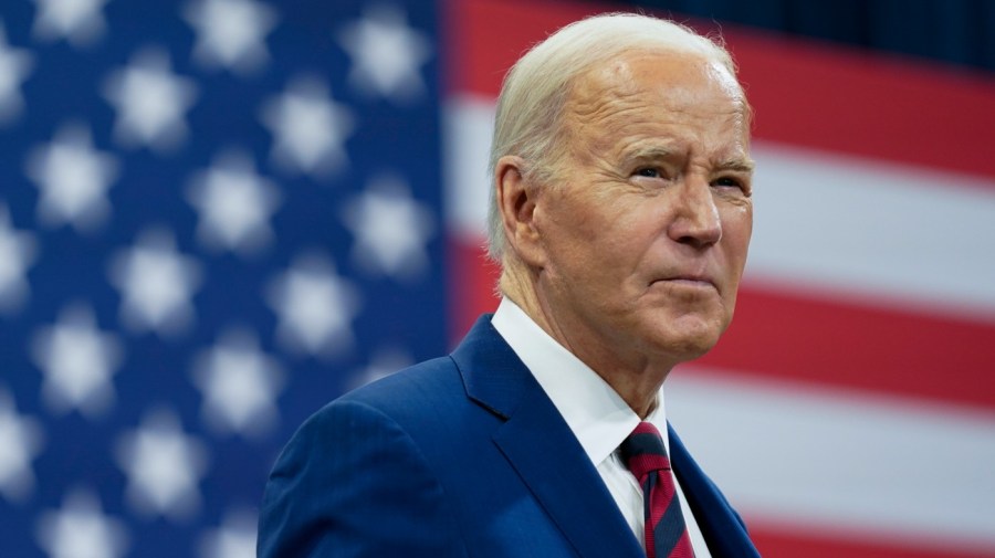 President Biden delivers remarks while standing in front of an American flag during a campaign event.