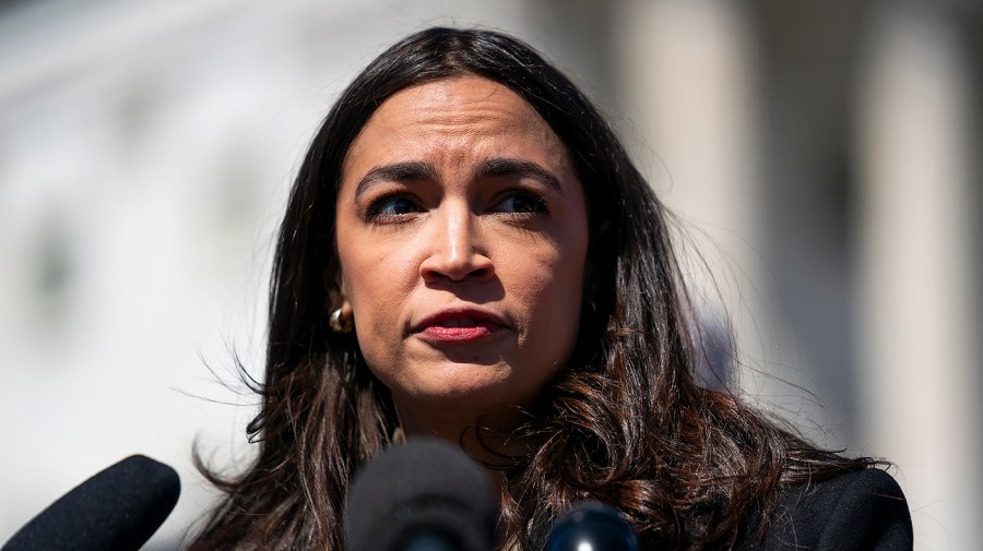 Representative Alexandria Ocasio-Cortez speaks to the press.