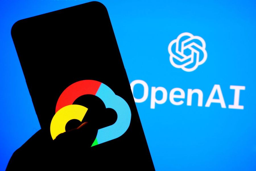 A Google Cloud logo is seen displayed on a smartphone with an Open AI Logo in the background.