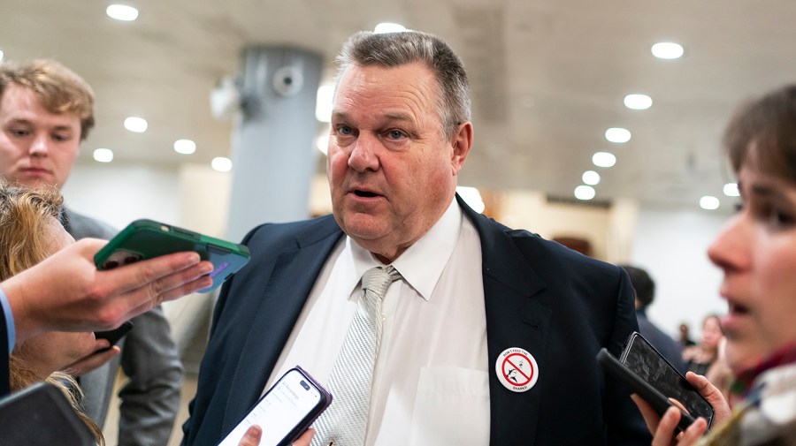 Senator Jon Tester is seen during an interview with the media.