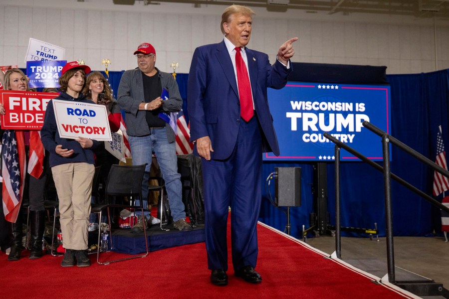 Republican presidential candidate former President Donald Trump takes the stage before speaking Tuesday, April 2, 2024, at a rally in Green Bay, Wis. (AP Photo/Mike Roemer)