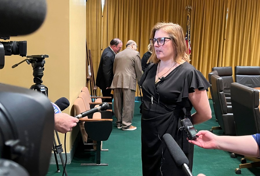 FILE - Nebraska state Sen. Machaela Cavanaugh speaks to reporters, Thursday, March 18, 2024, in Lincoln, Neb. A bill to limit transgender students’ access to bathrooms and sports teams has been advanced out of committee with just days to go until the end of the session. Cavanaugh says she will filibuster bills not yet passed if Omaha Sen. Kathleen Kauth's bathroom and sports bill advances. Speaker of the Legislature Sen. John Arch announced late Thursday, April 4, 2024, that the bill would be debated the next day for no more than four hours. (AP Photo/Margery Beck, File)