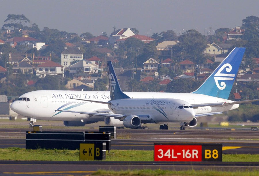 FILE - Two Air New Zealand passenger jets taxi past each other at Sydney Airport on July 13, 2003. A passenger has been fined for urinating in a cup during a delay on deplaning after landing at Sydney Airport. Officials said on Friday, April 5, 2024, in incident after a 3-hour Air New Zealand flight from Auckland occurred in December last year and a Sydney court fined the 53-year-old man 600 Australian dollars for offensive behavior in February. (AP Photo/Mark Baker, File)