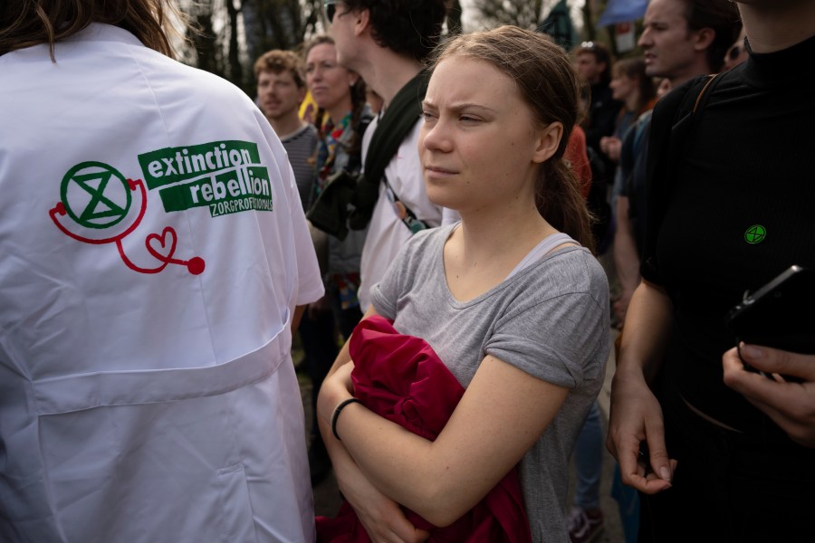 Climate activist Greta Thunberg joins a climate protest by Extinction Rebellion and other activists near the Dutch parliament, in The Hague, Netherlands, Saturday, April 6, 2024. (AP Photo/Peter Dejong)