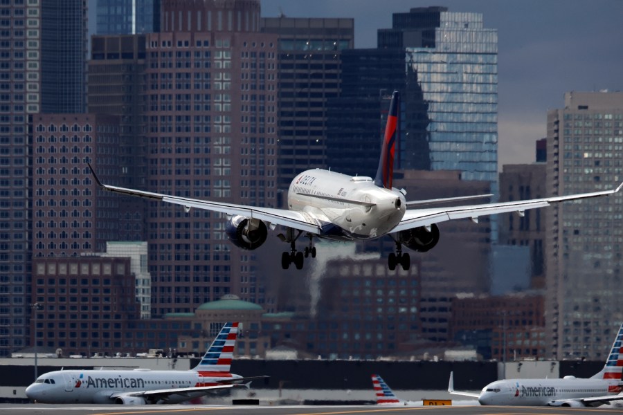 FILE - A Delta Air Lines plane lands at Logan International Airport, Jan. 26, 2023, in Boston. Delta reports earnings on Wednesday, April 10, 2024. (AP Photo/Michael Dwyer, File)