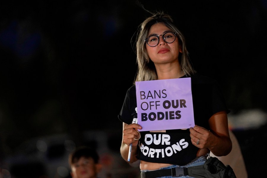 FILE - This file photo shows Celina Washburn at a protest on Sept. 23, 2022, outside the Arizona Capitol in Phoenix to voice her opposition to an abortion ruling. The Arizona Supreme Court ruled Tuesday, April 9, 2024, that the state can enforce its long-dormant law criminalizing all abortions except when a mother’s life is at stake. (AP Photo/Matt York, File)