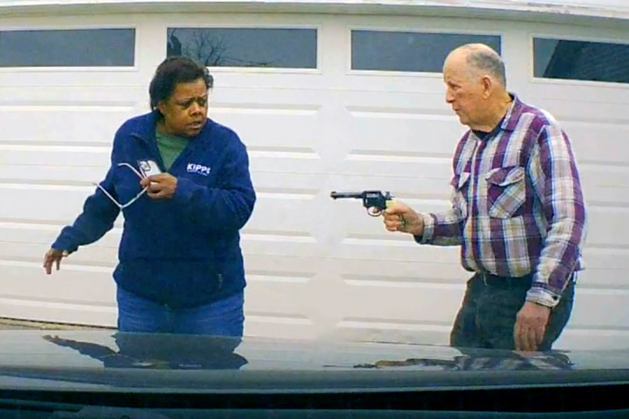 In this image taken from Uber dashcam video released by the Clark County, Ohio, Sheriff's Office, William Brock, right, holds a weapon to Uber driver Loletha Hall outside his home in South Charleston, Ohio, on March 25, 2024. Brock, 81, who authorities say fatally shot Hall who he thought was trying to rob him after scam phone calls deceived them both, was indicted on a murder charge, Monday, April 15, 2024, by a Clark County grand jury. Hall had no knowledge of the calls made to Brock, authorities said. (Clark County Sheriff's Office via AP)