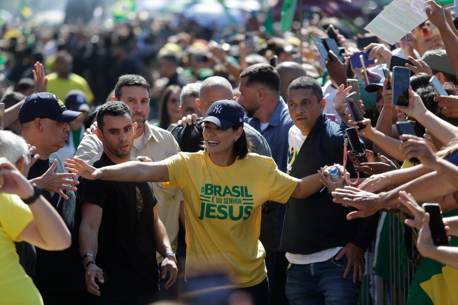 Former First Lady Michelle Bolsonaro greets supporters during a demonstration calling for freedom of expression, spurred by Brazilian court orders to suspend accounts on the social media platform X, in Copacabana beach, Rio de Janeiro, Brazil, Sunday, April 21, 2024. (AP Photo/Bruna Prado)