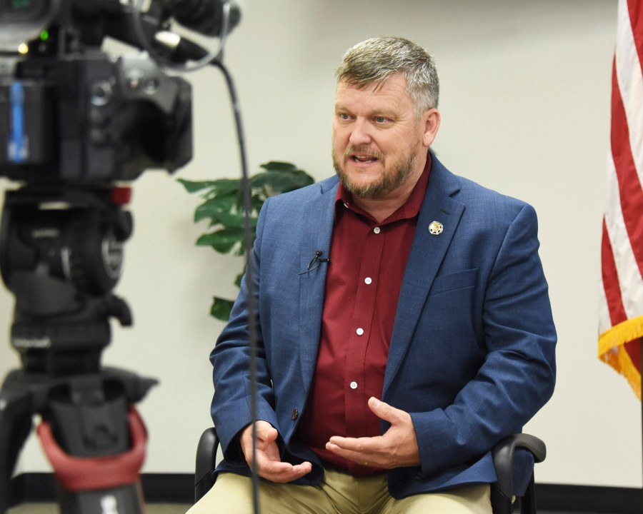 Justin Smith, a retired Colorado sherriff from Larimer County, Colo., speaks during a recording for the Committee of Safe and Secure Elections during a conference with local election and law enforcement officials Wednesday, April 10, 2024, in Traverse City, Mich. A top concern for local election workers throughout the country this year is their own safety. The committee, formed after the 2020 presidential election, is traveling the country helping prepare for what could lie ahead. Smith signed up after retiring last year and hearing from local election officials about the threats they have faced since 2020. (AP Photo/John L. Russell)