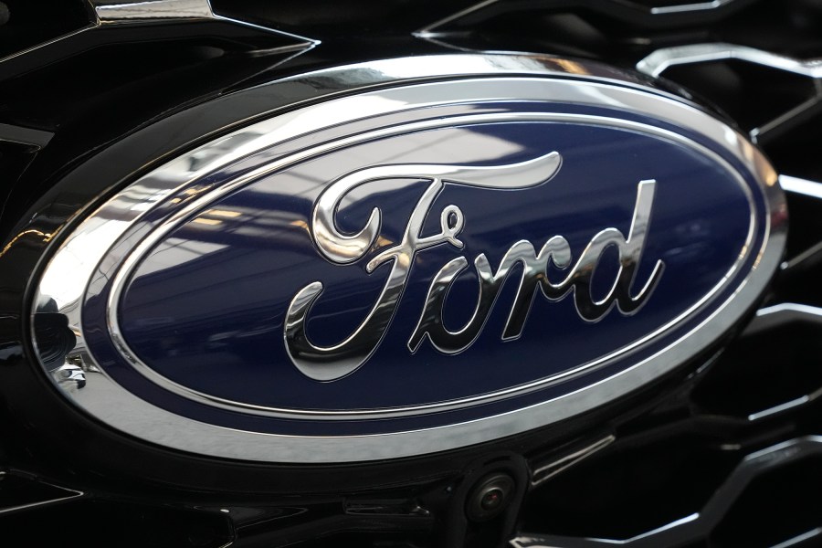 FILE - The Ford logo is seen on the grill of a Ford Explorer on display at the Pittsburgh International Auto Show in Pittsburgh, on Feb. 15, 2024. Two fatal crashes involving Ford’s Blue Cruise partially automated driving system have drawn the attention of U.S. auto safety regulators. (AP Photo/Gene J. Puskar, File)