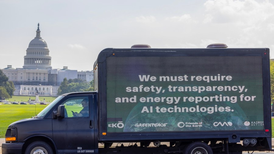 Mobile Billboard is seen outside the Capitol. Billboard reads "We must require safety, transparency, and energy reporting for AI technologies."