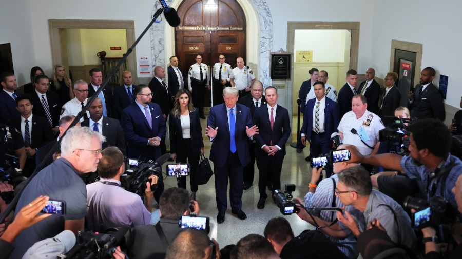 Former President Donald Trump speaks to the media.