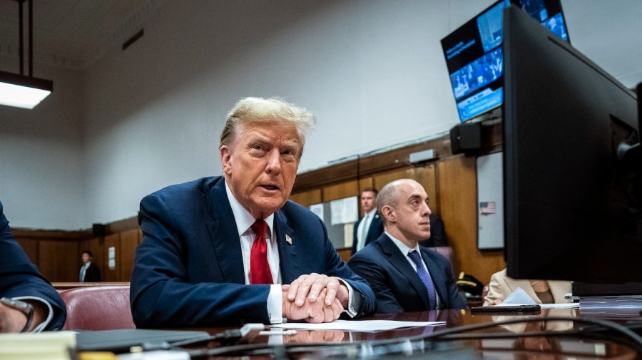 Former President Trump sits while at Manhattan criminal court