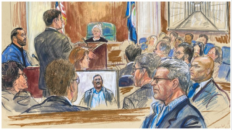 This artist sketch depicts Salah Al-Ejaili, foreground with glasses, a former Al-Jazeera journalist, before the U.S. District Court in Alexandria, Va., Tuesday, April 16, 2024. Al-Ejaili, a former detainee at the infamous Abu Ghraib prison, has described to jurors the type of abuse that is reminiscent of the scandal that erupted there 20 years ago: beatings, being stripped naked and threatened with dogs, stress positions meant to induce exhaustion and pain. (Dana Verkouteren via AP)