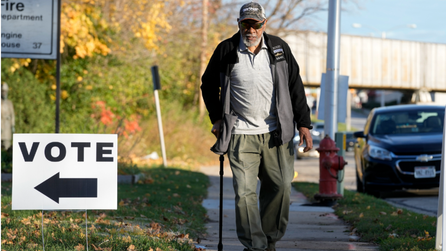 A man makes his way to cast his ballot in the midterm election, Nov. 8, 2022, in Milwaukee.