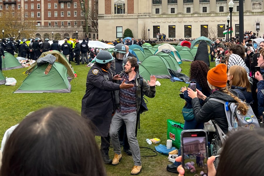 New York Police officers arrest a protester at the site of an encampment on the Columbia University campus.