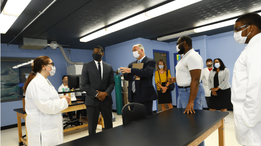 Environmental Protection Administrator Michael Regan (2nd-L) and U.S. Rep. Dan Kildee (D-MI) (3rd-L) tour the Flint Community Water Lab on July 07, 2021 in Flint, Michigan.