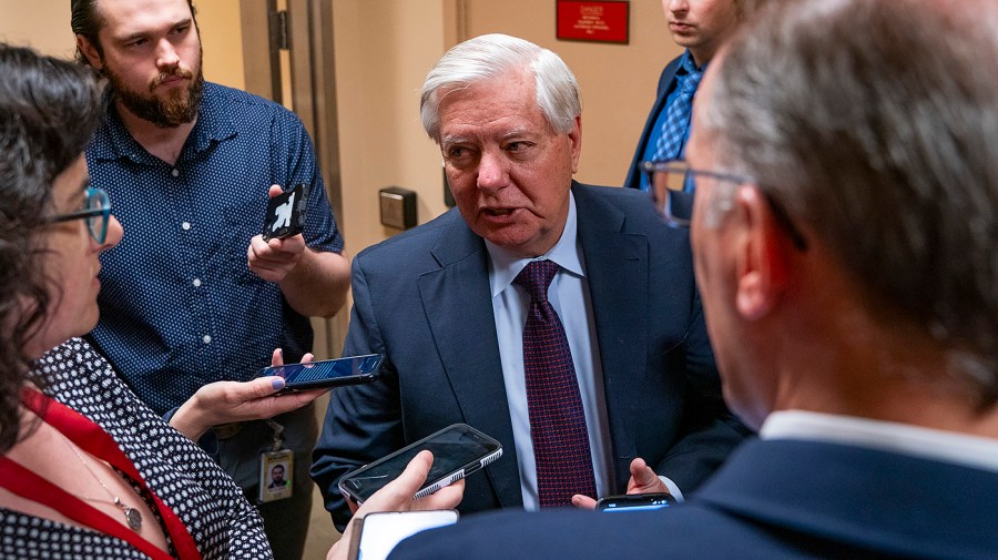 Senator Lindsey Graham speaks to reporters.