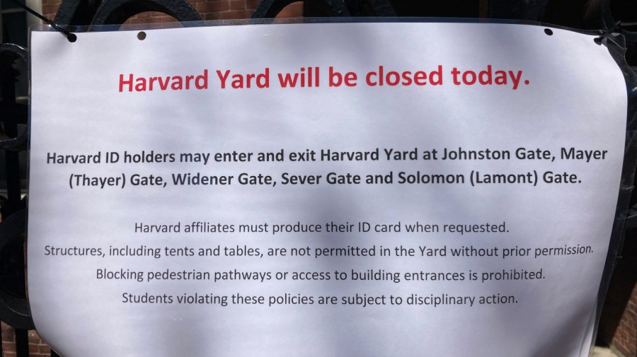 A sign outside Harvard Yard warns that only those with Harvard IDs can enter the yard.