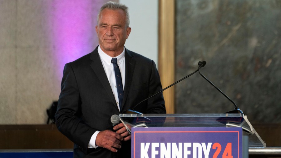 Independent presidential candidate Robert F. Kennedy Jr. stands at a podium.